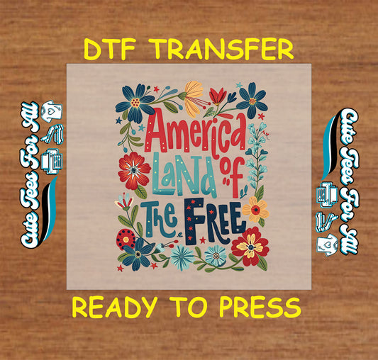 DTF transfer with “America Land of the Free” text and patriotic floral border in red, blue, and yellow.