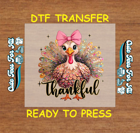 Thanksgiving turkey with pink bow and colorful feathers with Thankful text ready to press dtf transfer for DIY shirts