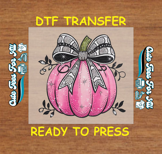 Sparkly pink pumpkin with black glitter bow ready to press dtf transfer for DIY shirts