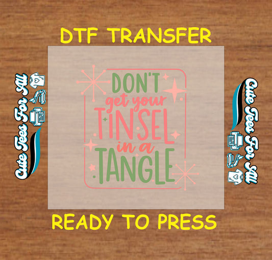 Funny Christmas DTF transfer with phrase “Don’t Get Your Tinsel in a Tangle” in retro lettering with stars, ready to press iron on heat transfer for DIY shirts.