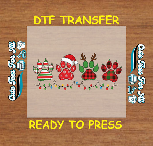 Christmas DTF transfer with festive paw prints, Santa hat, reindeer antlers, and holiday lights, ready to press iron on heat transfer for DIY shirts.