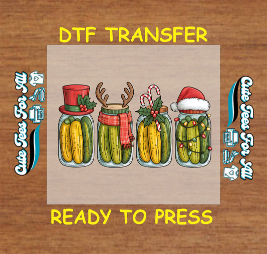 Christmas DTF transfer with four pickle jars decorated with Santa hat, reindeer antlers, top hat, candy canes, and lights, ready to press dtf heat transfer