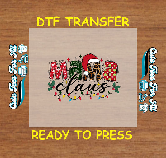 Christmas ready to press DTF transfer with "Mama Claus" text in festive patterns, Santa hat, holly, and Christmas lights.