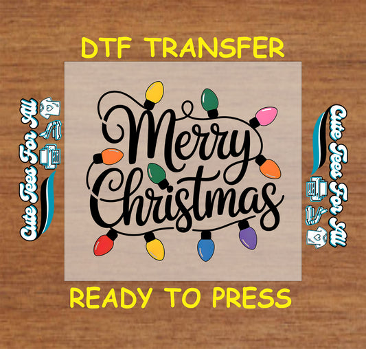 Christmas ready to press DTF transfer with Merry Christmas text and colorful holiday lights.