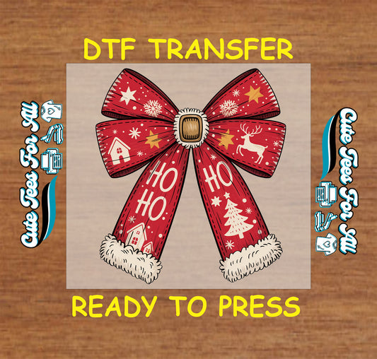 Christmas DTF transfer with red holiday bow, Ho Ho Ho text, and winter icons.