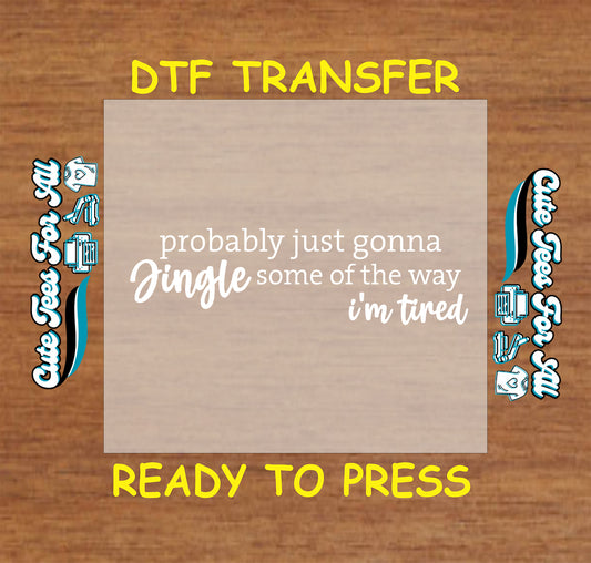 Funny Christmas ready to press DTF transfer with the phrase probably just gonna jingle some of the way I’m tired in white text