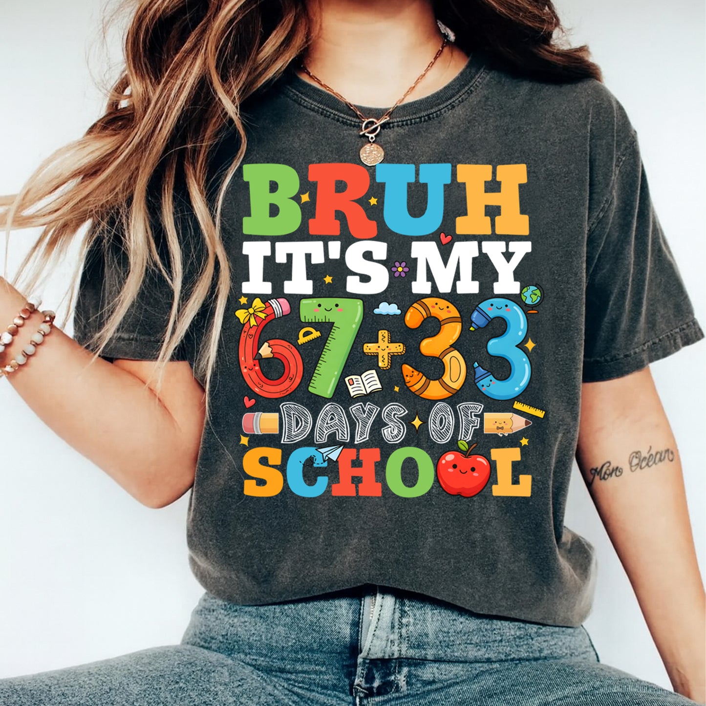Ready to press dtf school transfer mockup shown pressed on a shirt, featuring “Bruh it’s my 67+33 days of school” with colorful classroom icons and numbers