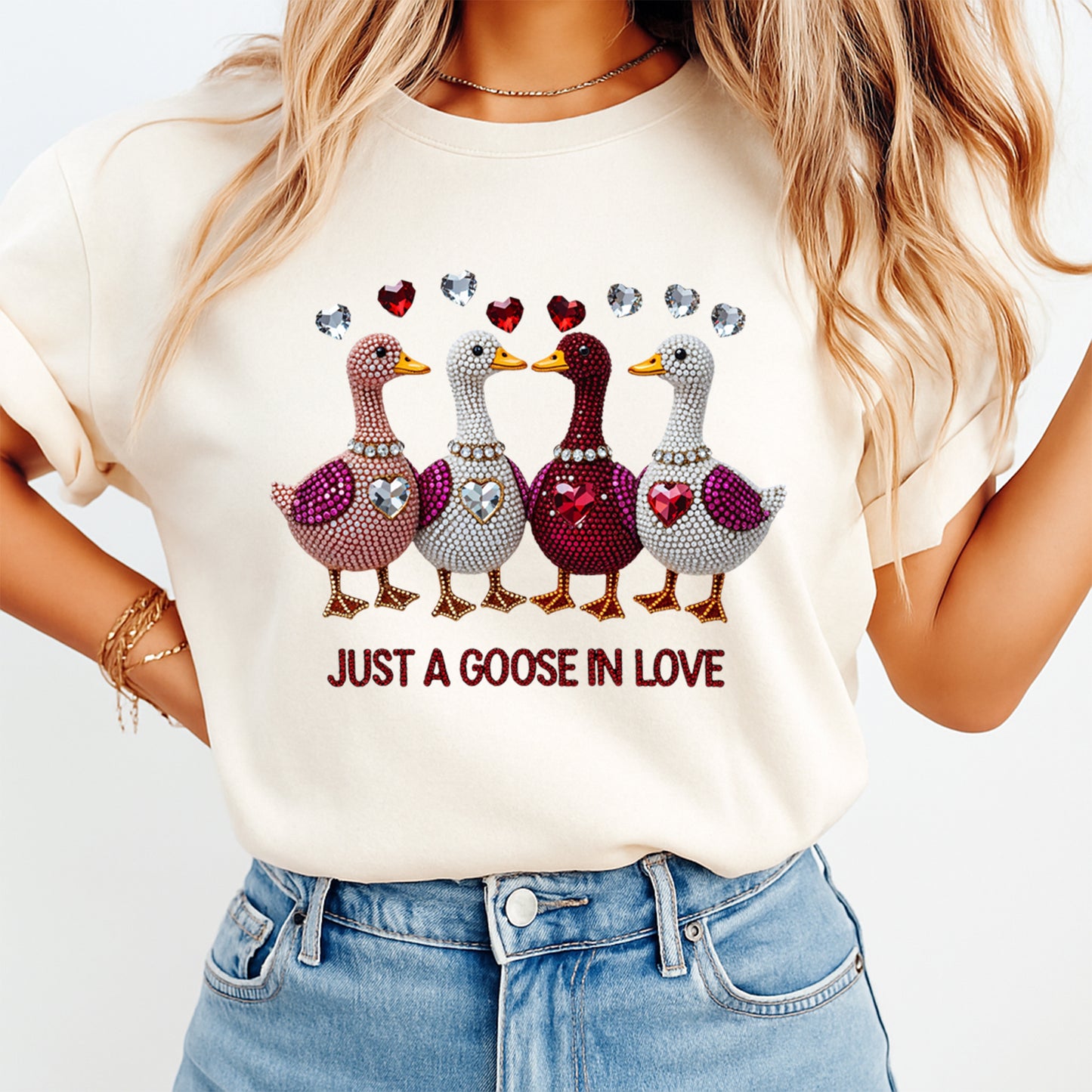 woman wearing cream shirt with valentine goose love ready to press dtf transfer featuring rhinestone geese heart gems and love phrase
