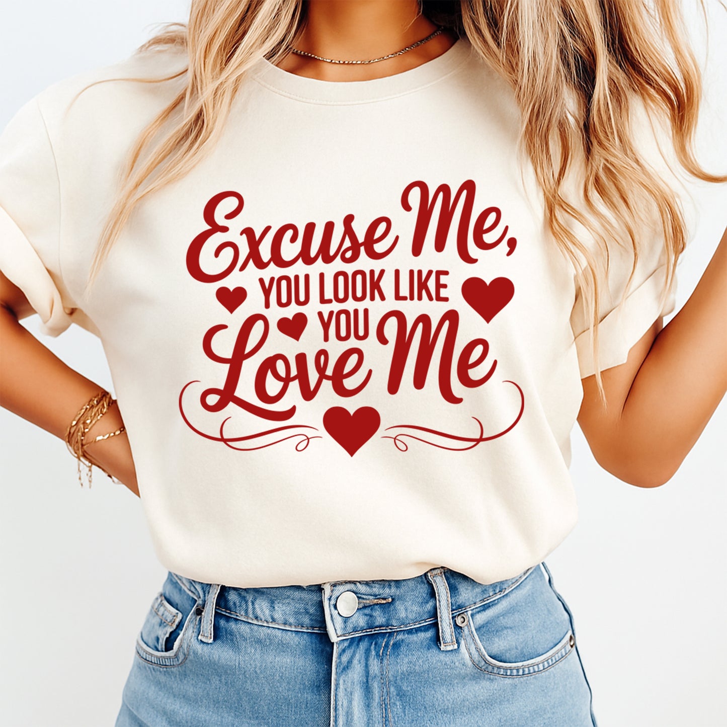 Cream t shirt mockup showing Valentine’s Day Excuse Me You Look Like You Love Me red quote graphic with hearts and flourish details on the front