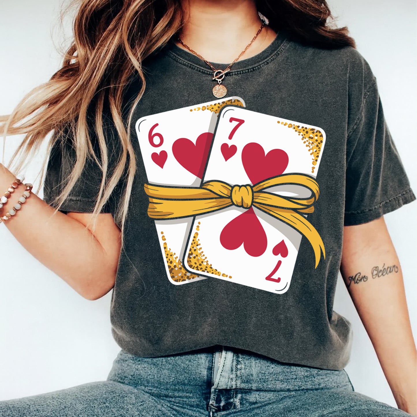 Valentine’s Day playing cards heart graphic pressed on shirt mockup with red hearts and gold ribbon