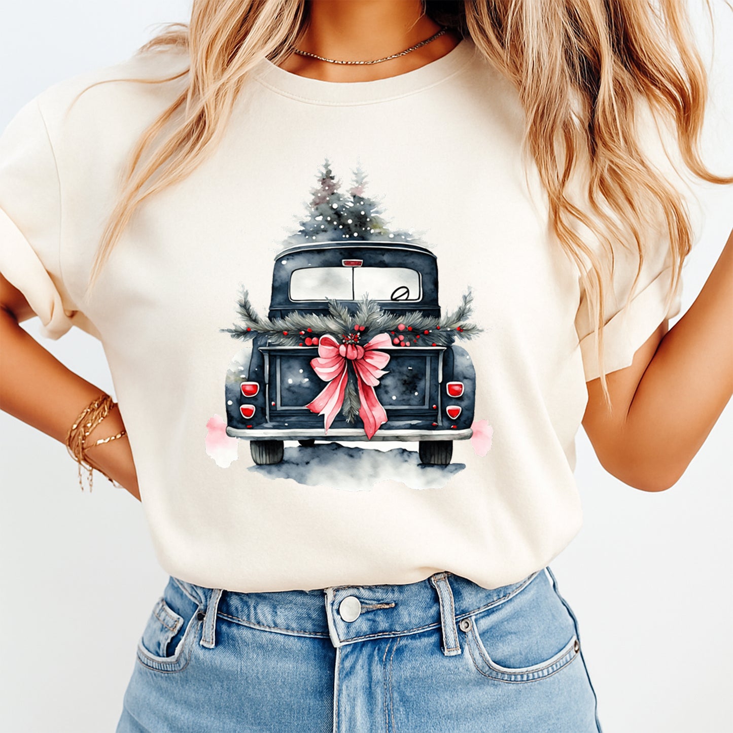 cream shirt mockup showing vintage christmas truck carrying tree with red bow graphic