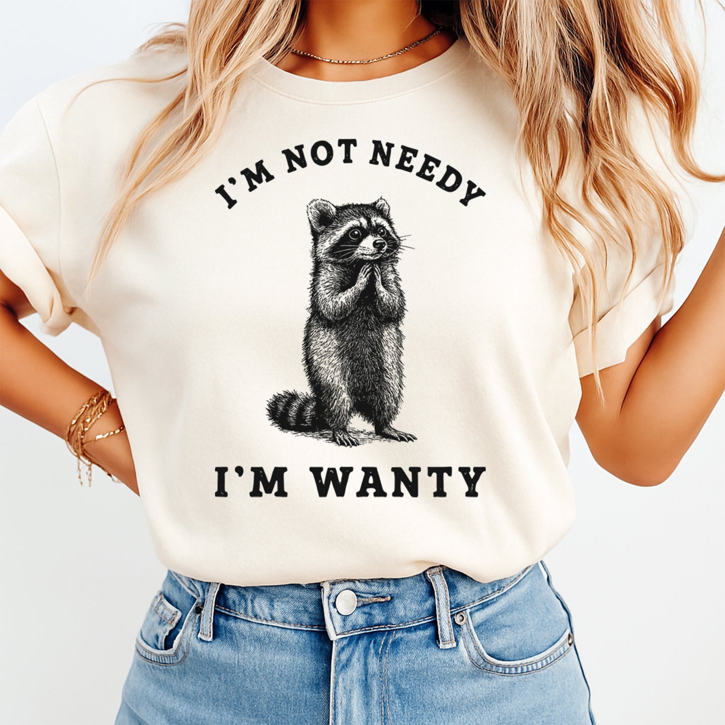 Sarcastic raccoon shirt mockup showing I’m Not Needy I’m Wanty phrase with vintage animal illustration on light tee