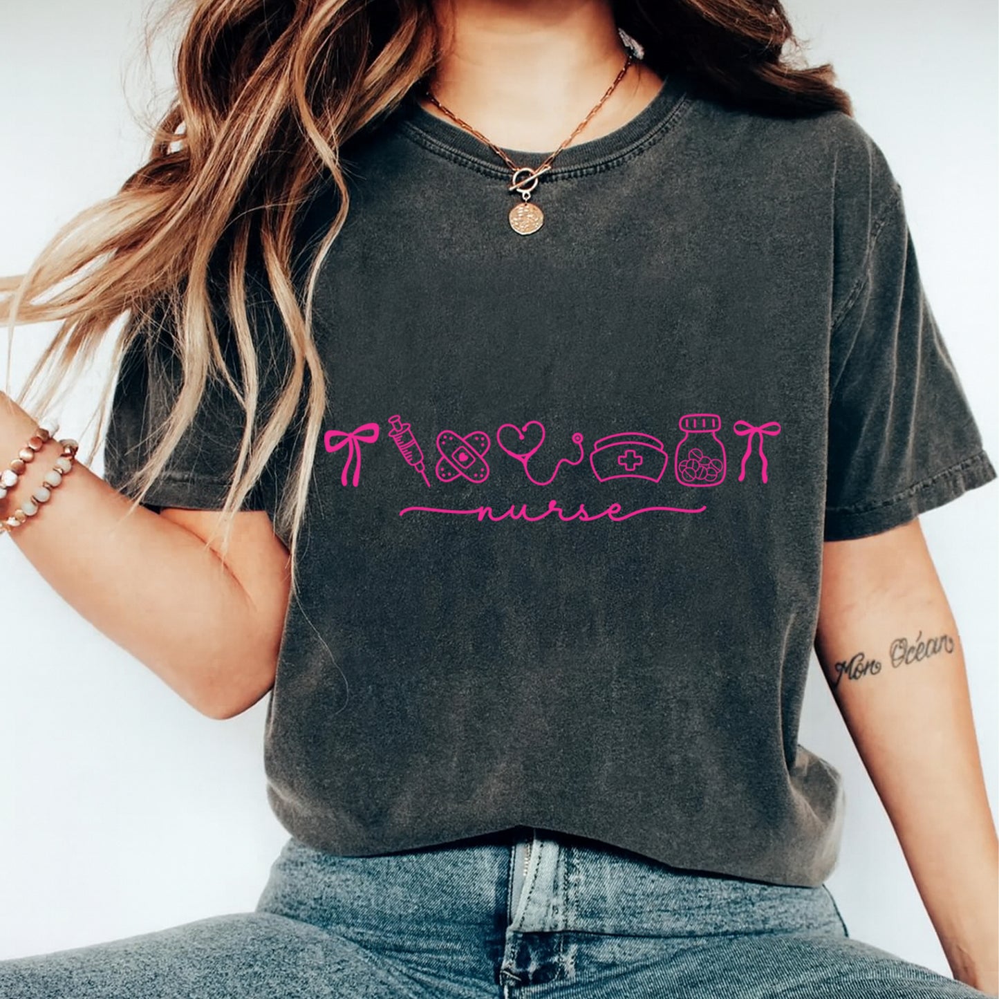 Nurse shirt mockup featuring pink line art nurse icons and script design for diy nurse shirts