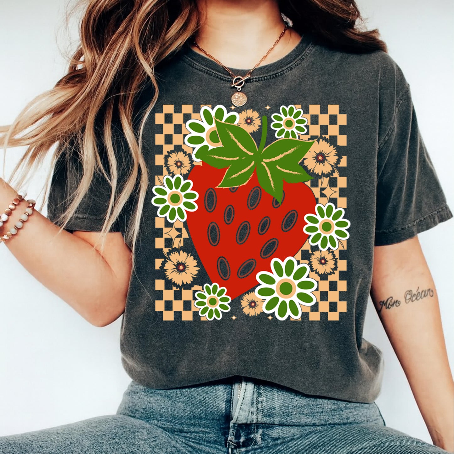 Dark gray t shirt mockup featuring strawberry floral checkerboard graphic, summer fruit shirt preview