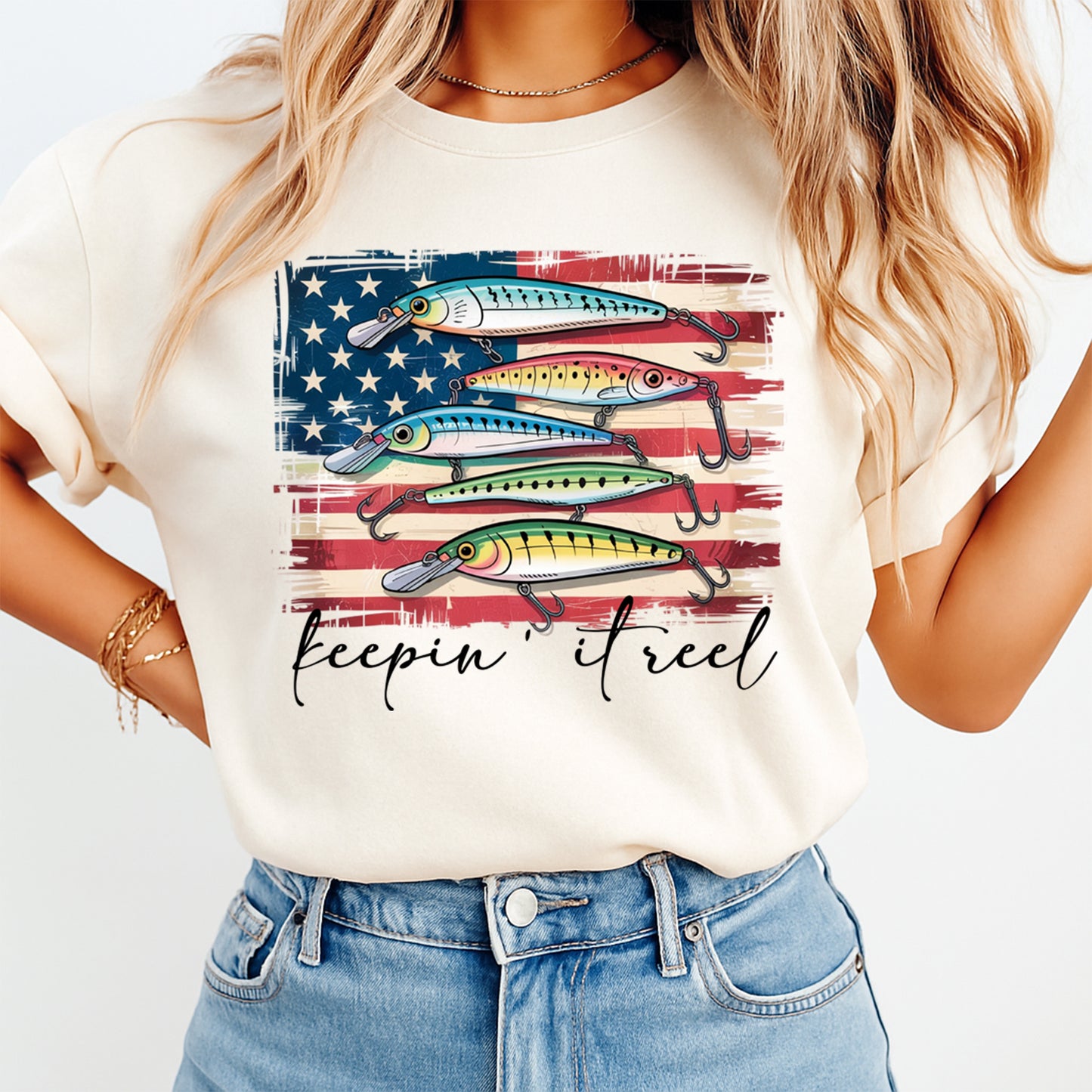Woman wearing beige shirt with patriotic fishing lure heat transfer graphic and Keepin It Reel quote