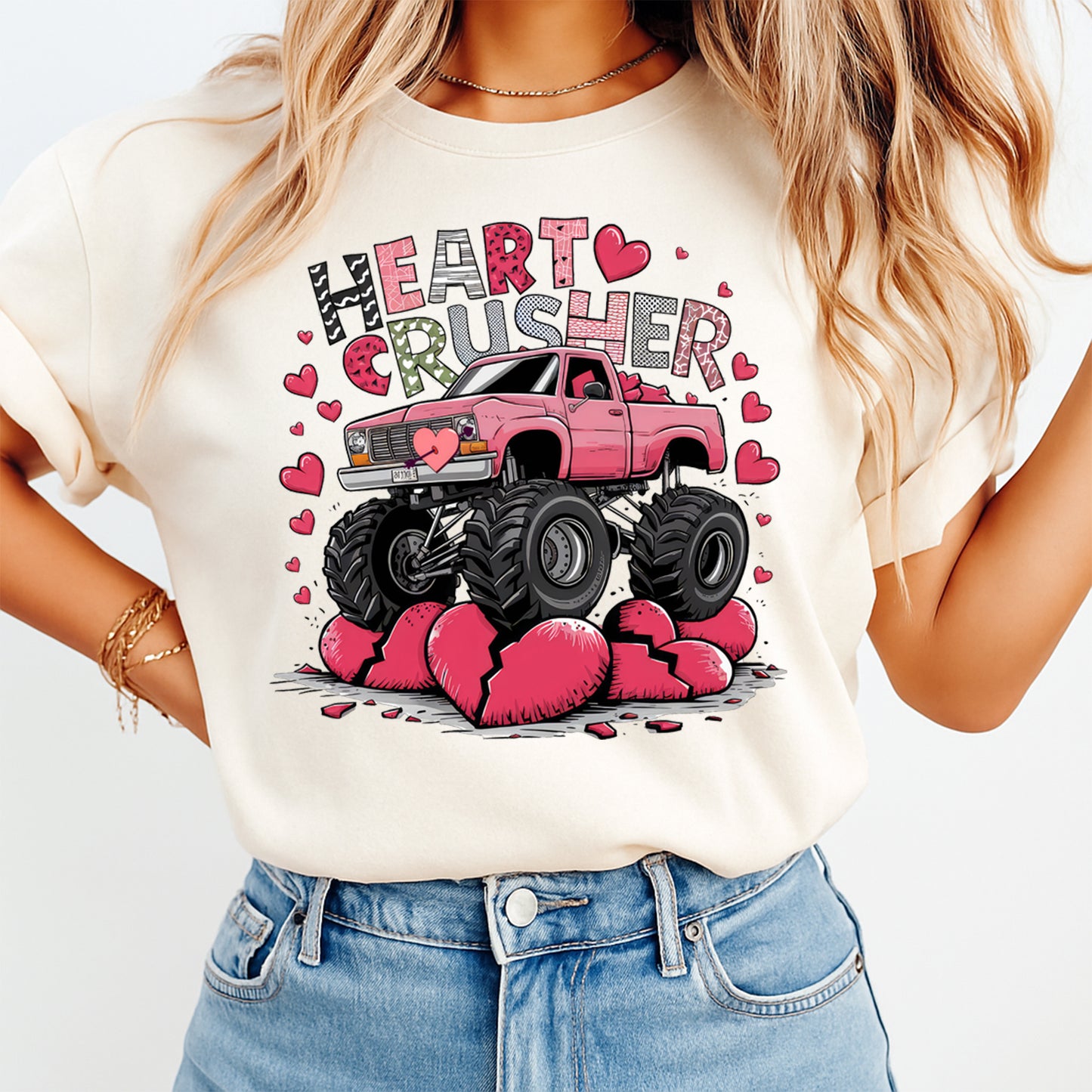 Woman wearing Heart Crusher Valentine shirt with pink monster truck and broken heart graphic