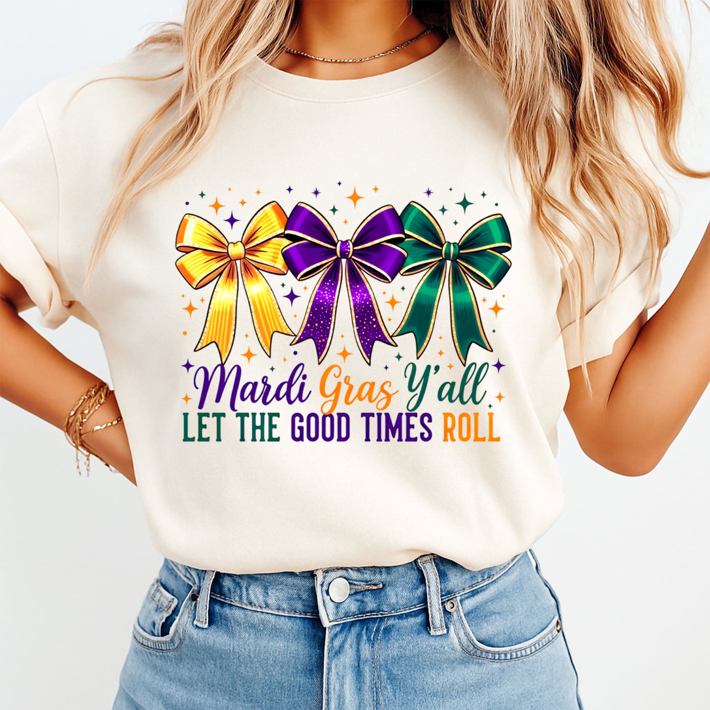 Purple green and gold Mardi Gras bow graphic printed on cream shirt for parade outfit