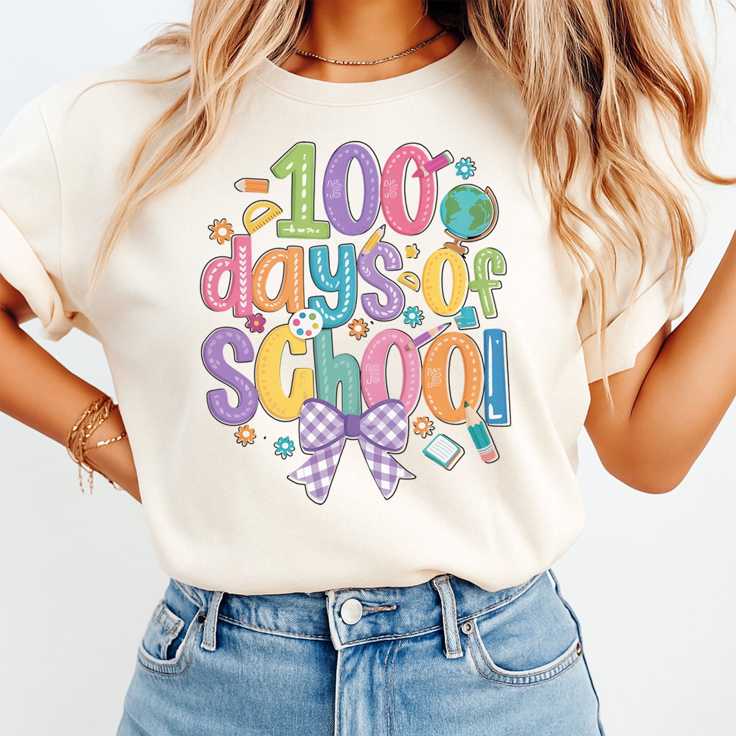 pastel 100 days of school shirt mockup with colorful school lettering classroom icons and purple bow graphic