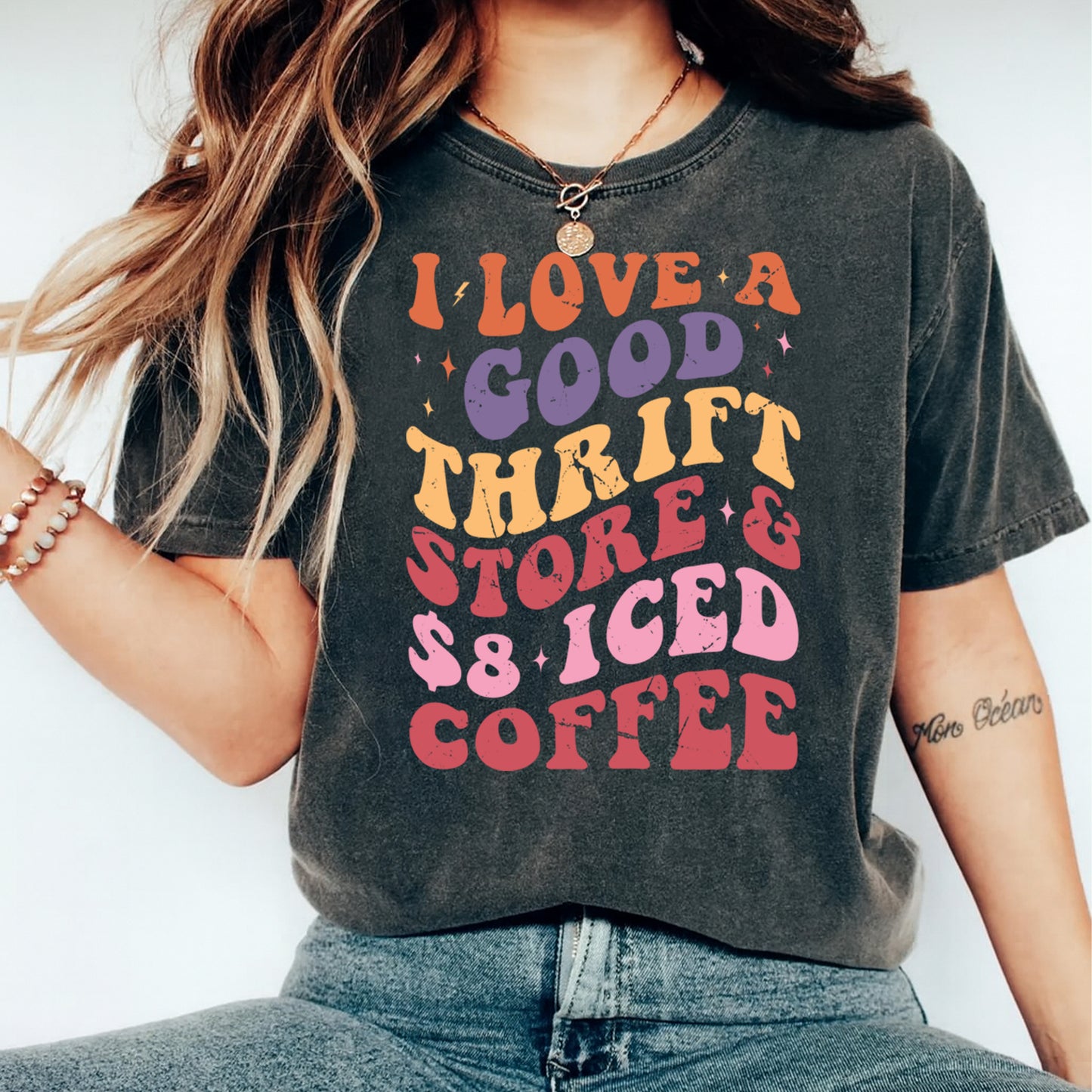 woman wearing i love a good thrift store and iced coffee retro graphic shirt ready to press dtf transfer design