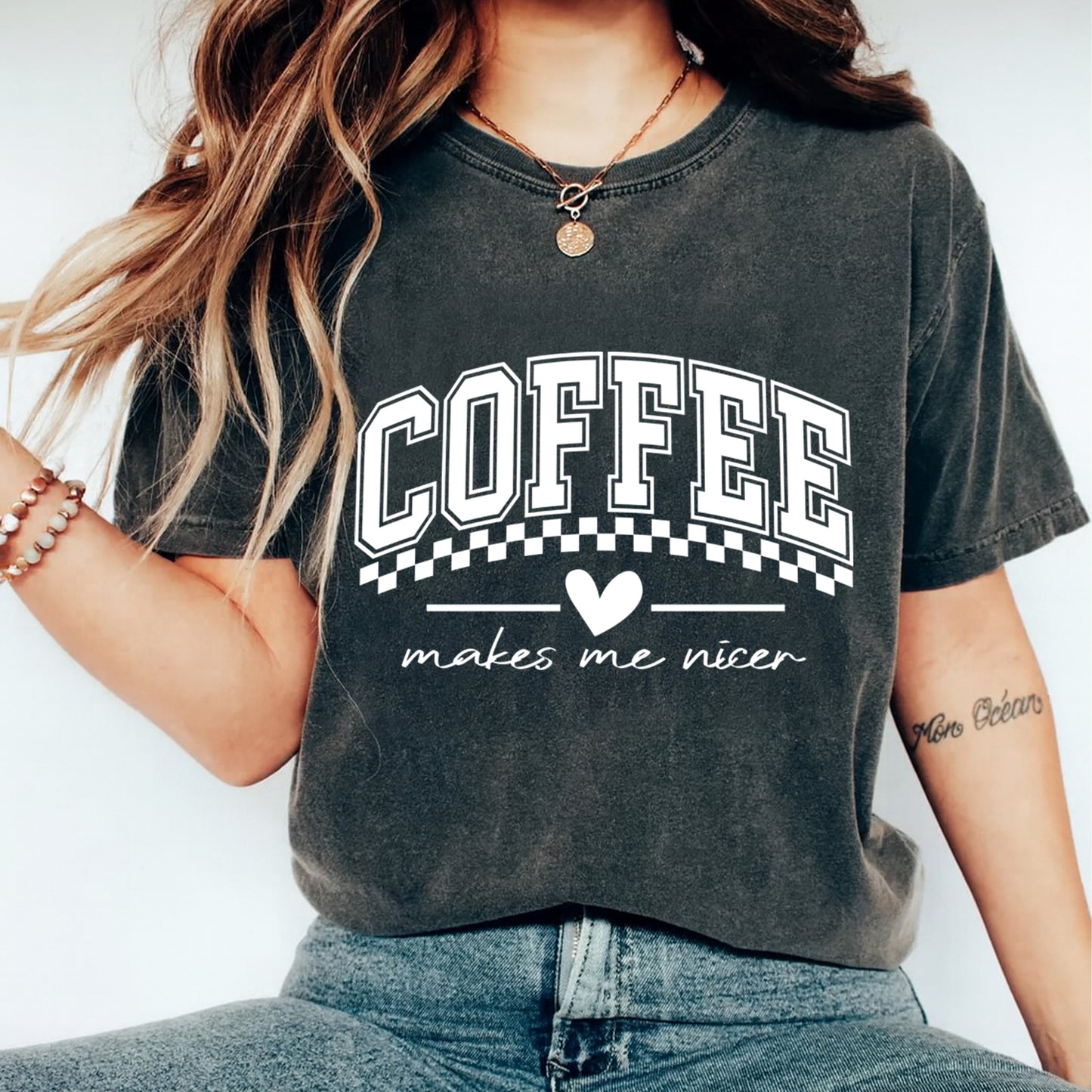 woman wearing coffee makes me nicer varsity style shirt ready to press dtf transfer applied