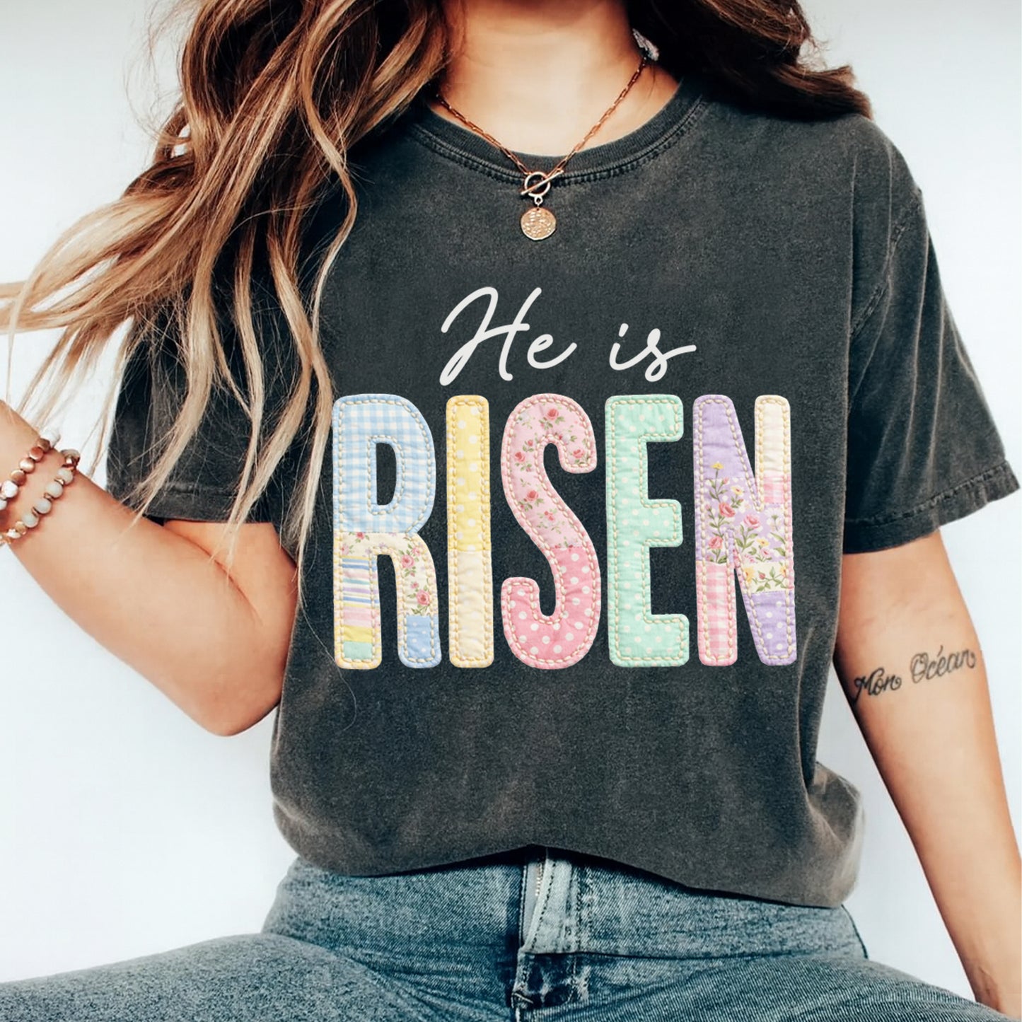 woman wearing he is risen pastel floral patchwork shirt ready to press dtf transfer applied on dark tee
