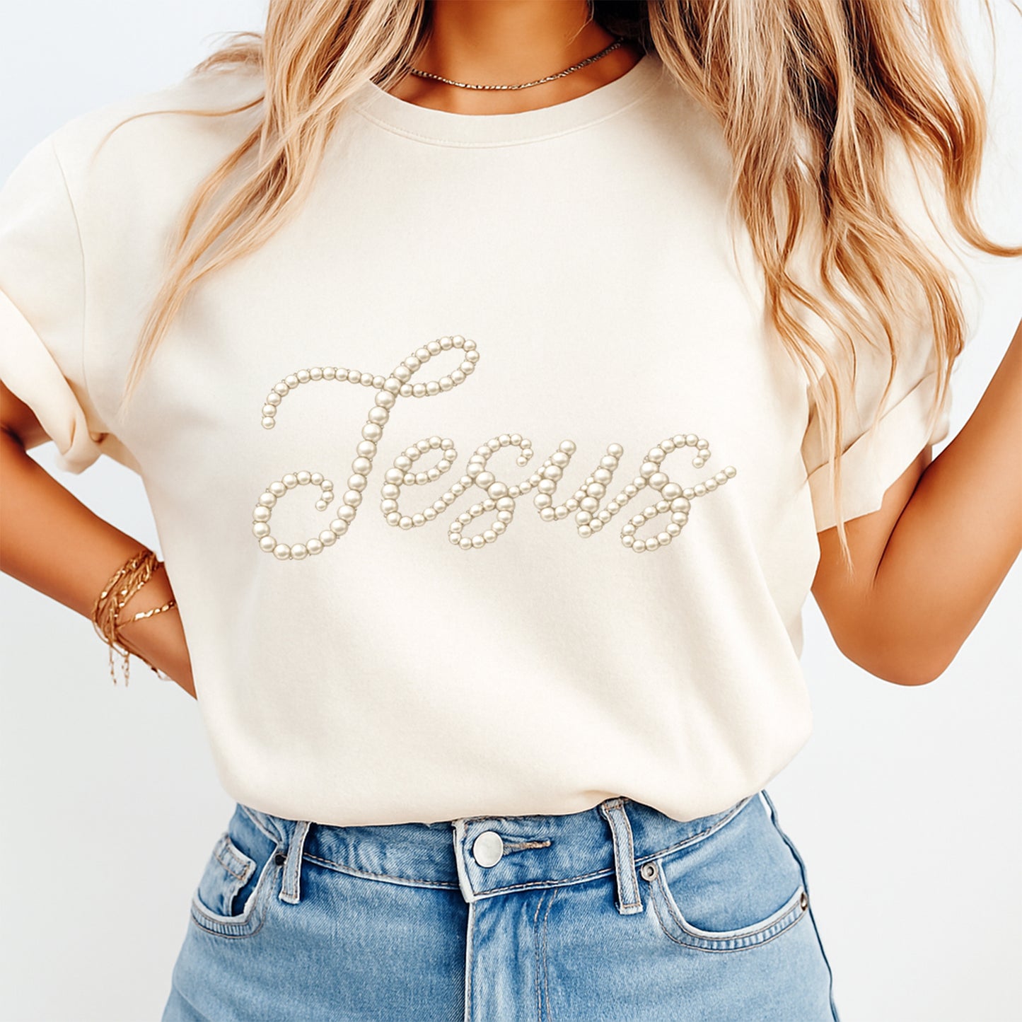 woman wearing beige t shirt with jesus pearl script dtf transfer minimalist christian faith design