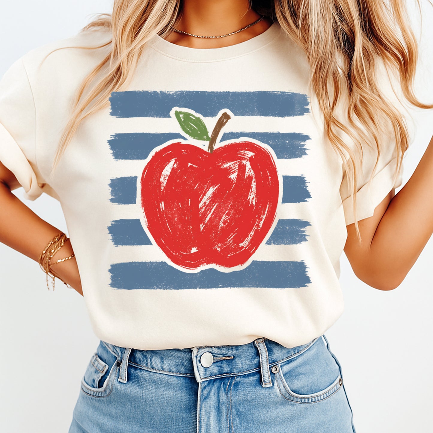Person wearing a t-shirt with a red apple graphic on a white background