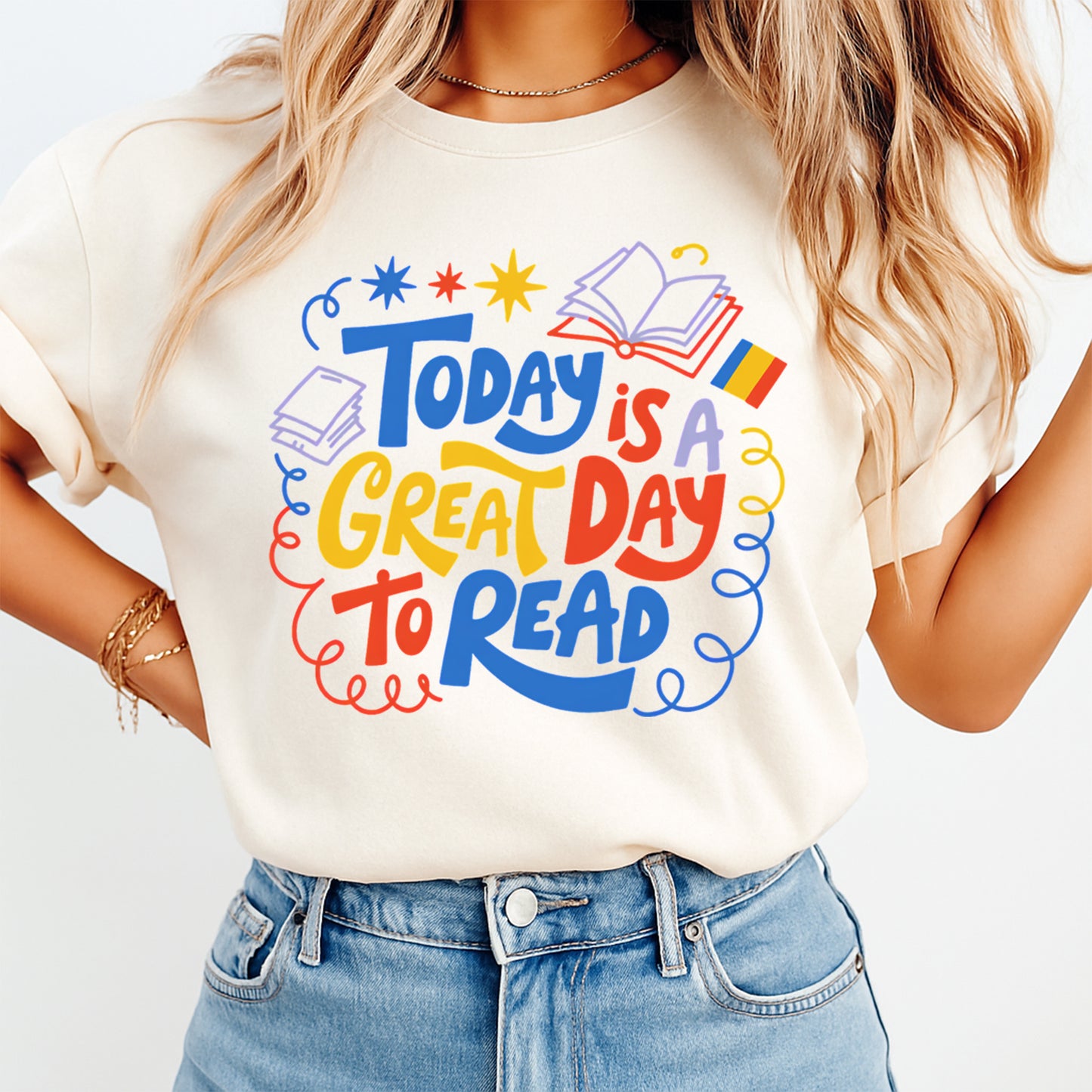Person wearing a t-shirt with 'Today is a great day to read' text and graphics.