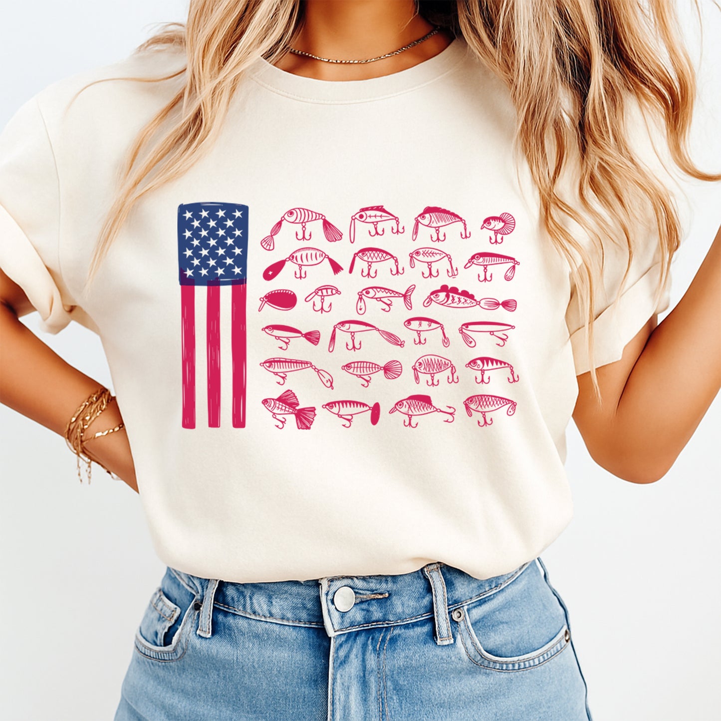Person wearing a white t-shirt with an American flag and fish illustrations on a plain background