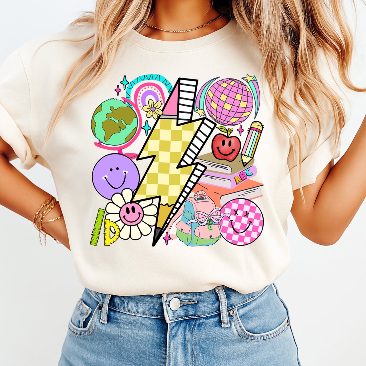 Person wearing a white t-shirt with colorful graphic design on a plain background