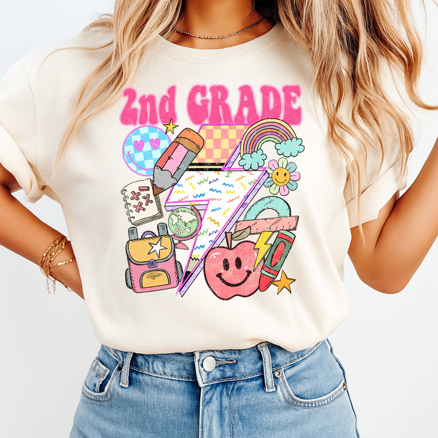 Person wearing a white t-shirt with colorful '2nd Grade' graphics and text.