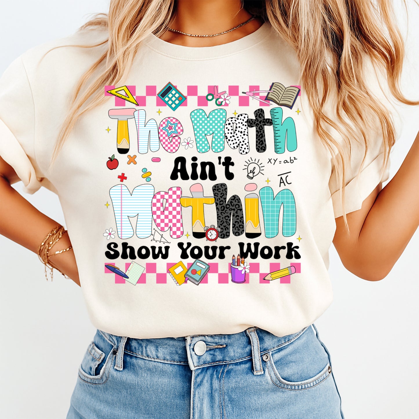 Person wearing a t-shirt with a colorful math-themed design and text.