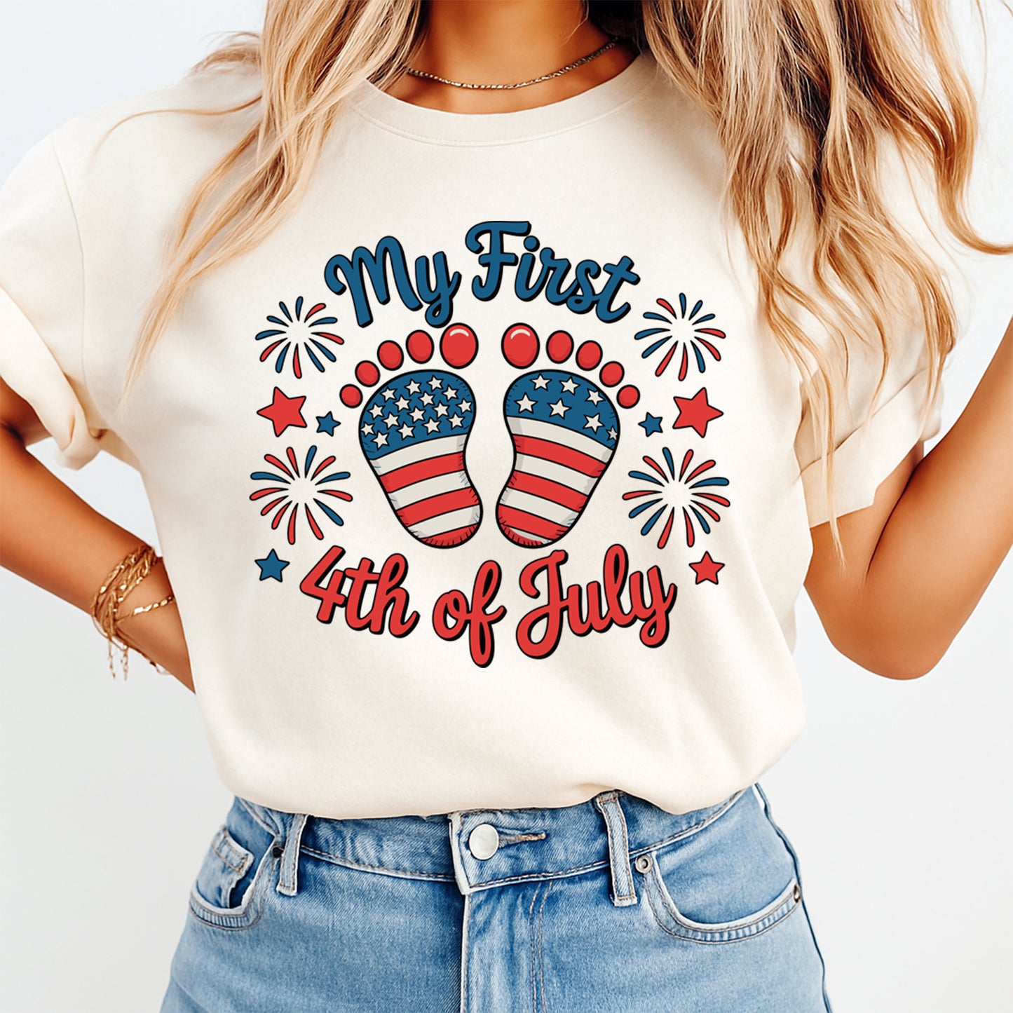 Person wearing a t-shirt with 'My First 4th of July' design featuring American flag colors and fireworks.