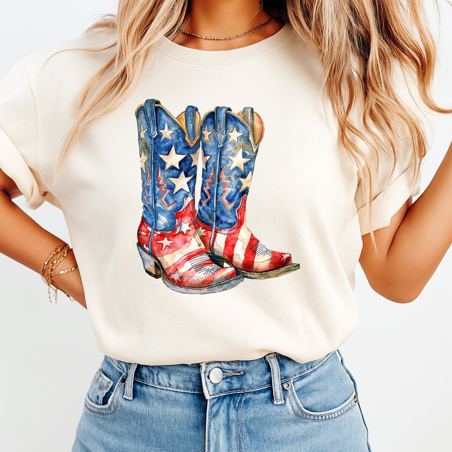 Person wearing a white t-shirt with American flag cowboy boots design.