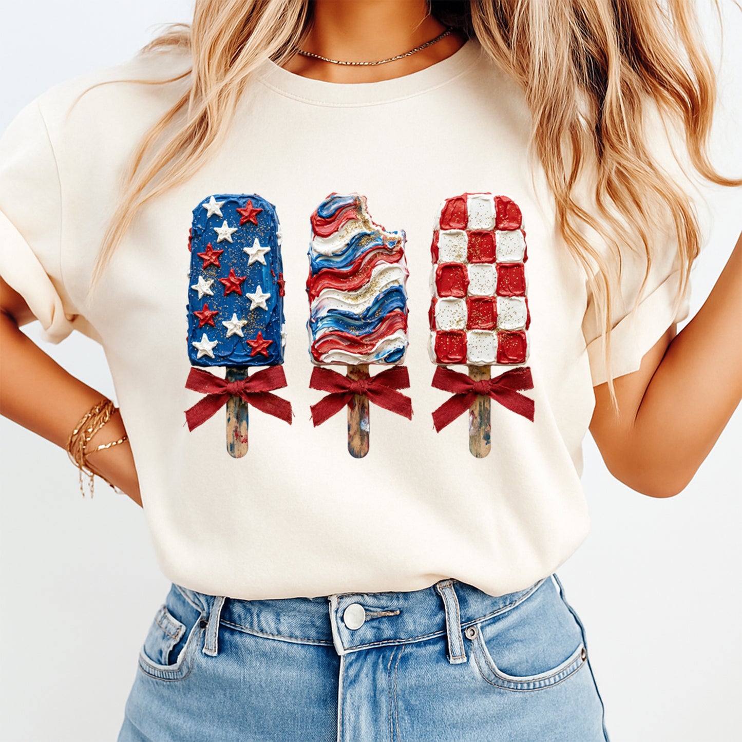Person wearing a white t-shirt with patriotic ice cream pops graphic
