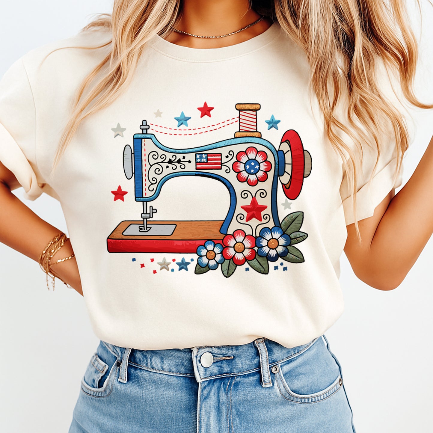 Person wearing a white t-shirt with a colorful sewing machine graphic design.