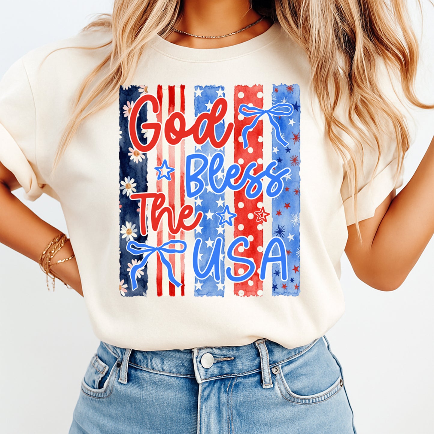 Person wearing a white t-shirt with 'God Bless The USA' design on a plain background