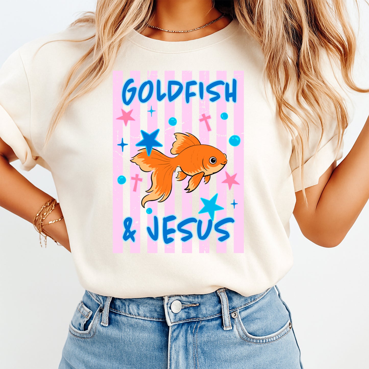 Person wearing a t-shirt with 'Goldfish & Jesus' design on a plain background
