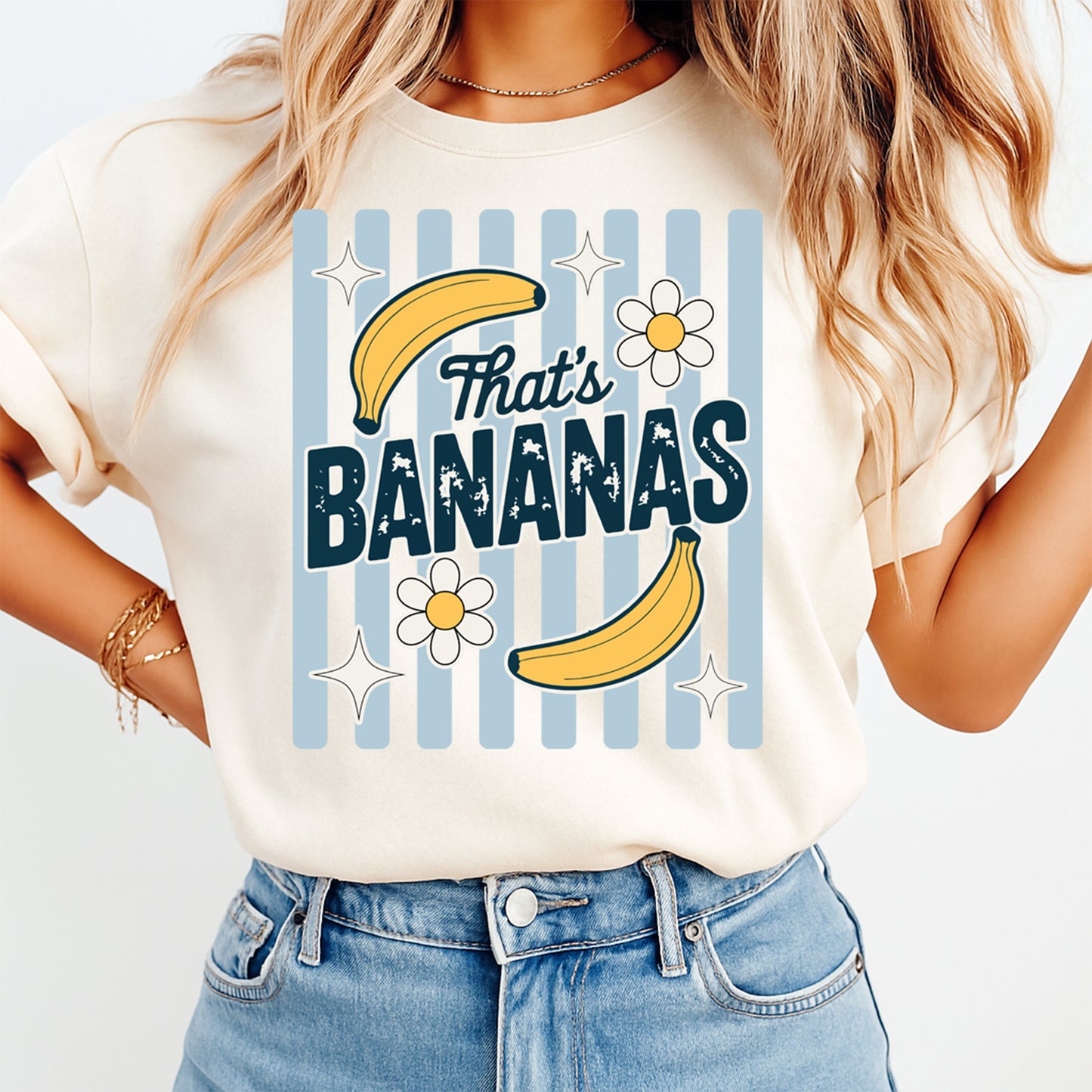 Person wearing a t-shirt with 'That's Bananas' design on a plain background
