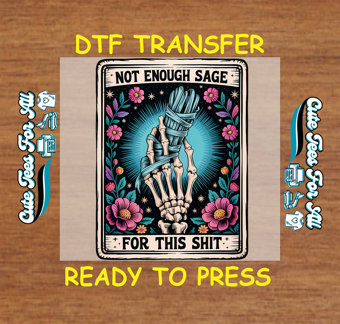 A DTF transfer design preview featuring a skeleton hand wrapped in blue sage leaves, surrounded by pink flowers and a teal burst, with the text 'NOT ENOUGH SAGE FOR THIS SHIT'. The design is shown on a beige transfer paper mockup over a wood background, with yellow text reading 'DTF TRANSFER' and 'READY TO PRESS'.