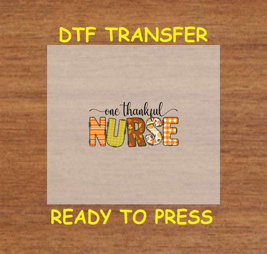 Thanksgiving-themed DTF transfer design with the phrase "One Thankful Nurse" in festive autumn colors and patterns.
