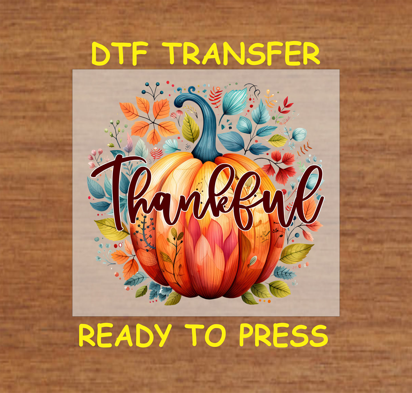Thanksgiving DTF transfer featuring a vibrant pumpkin surrounded by colorful autumn leaves with the word "Thankful" in elegant script.