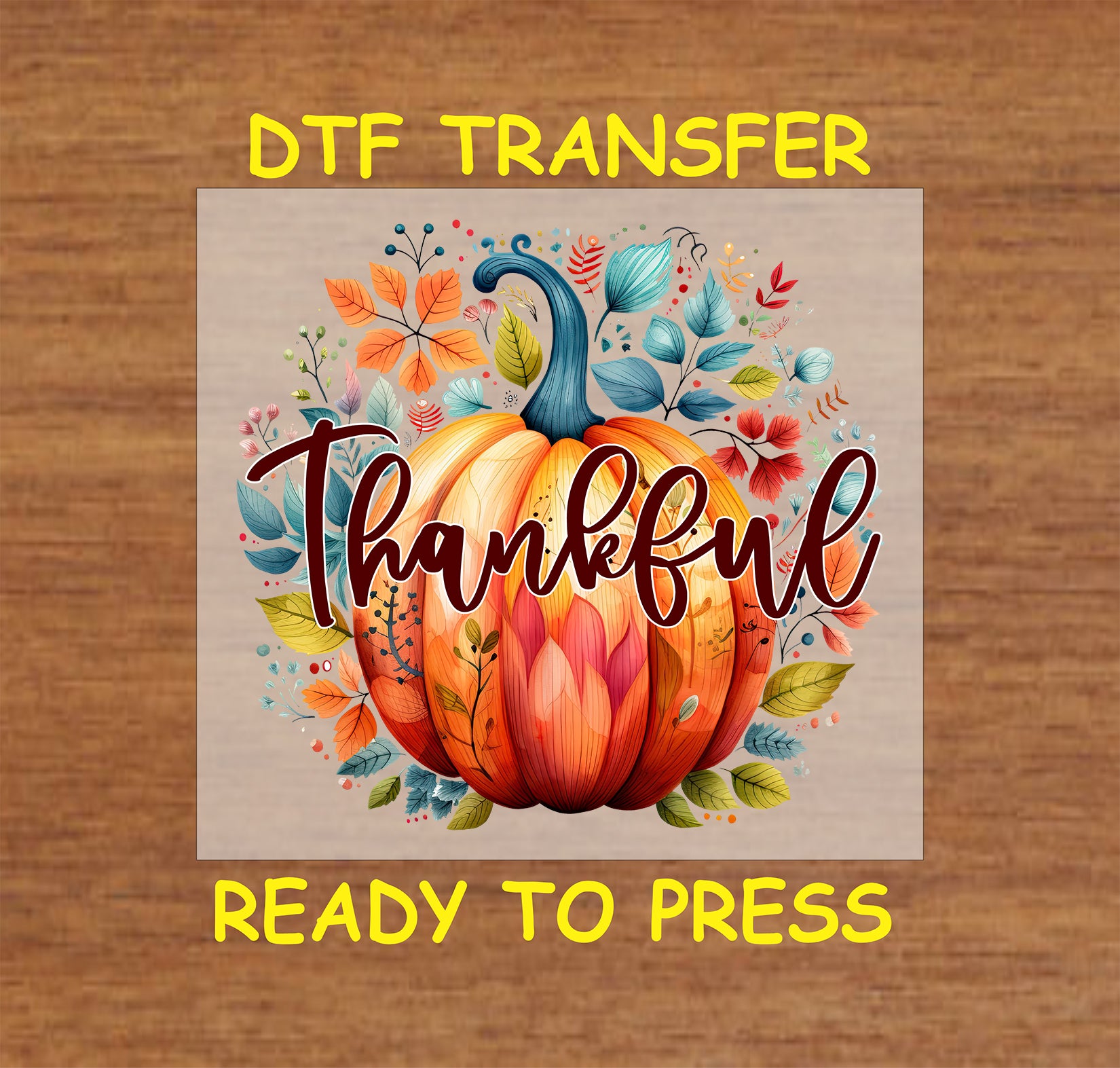 Thanksgiving DTF transfer featuring a vibrant pumpkin surrounded by colorful autumn leaves with the word "Thankful" in elegant script.