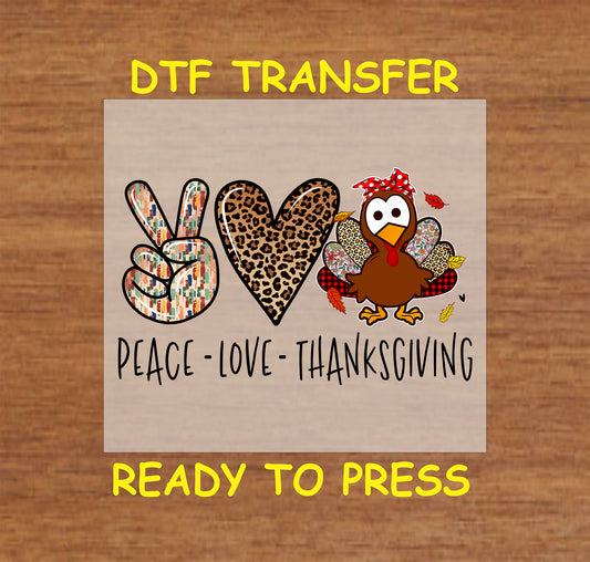Thanksgiving DTF transfer featuring "Peace, Love, Thanksgiving" with a peace sign, leopard heart, and a colorful turkey.