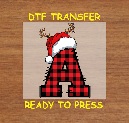 DTF transfer featuring a buffalo plaid letter "A" adorned with a Santa hat and reindeer antlers, perfect for personalized Christmas apparel or gifts.