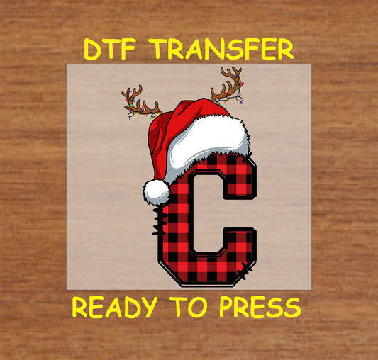 DTF transfer featuring a buffalo plaid letter "B" adorned with a Santa hat and reindeer antlers, perfect for custom Christmas apparel or gifts.