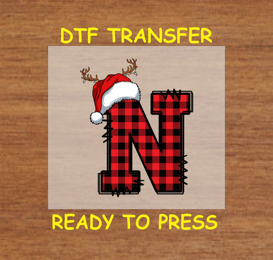 DTF transfer featuring a buffalo plaid letter "N" adorned with a Santa hat and reindeer antlers, perfect for festive holiday apparel and Christmas crafting.