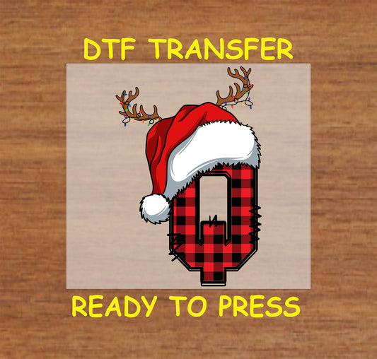DTF transfer featuring a buffalo plaid letter "Q" adorned with a Santa hat and reindeer antlers, ideal for festive Christmas crafting and personalized holiday gifts.