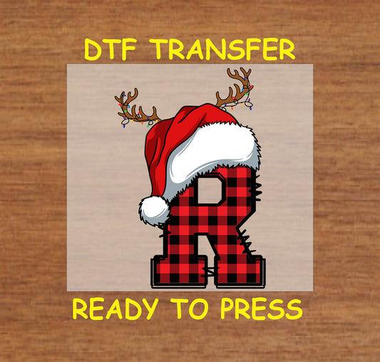 DTF transfer featuring a buffalo plaid letter "R" adorned with a Santa hat and reindeer antlers, perfect for festive holiday apparel and personalized Christmas gifts.