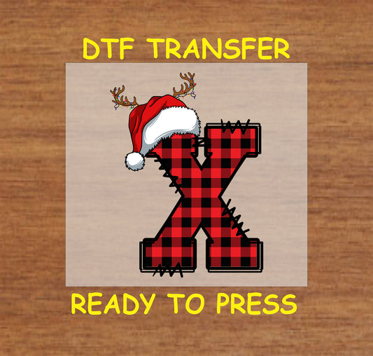 DTF transfer featuring a buffalo plaid letter "X" with a Santa hat and reindeer antlers, ideal for holiday crafts and personalized Christmas projects.